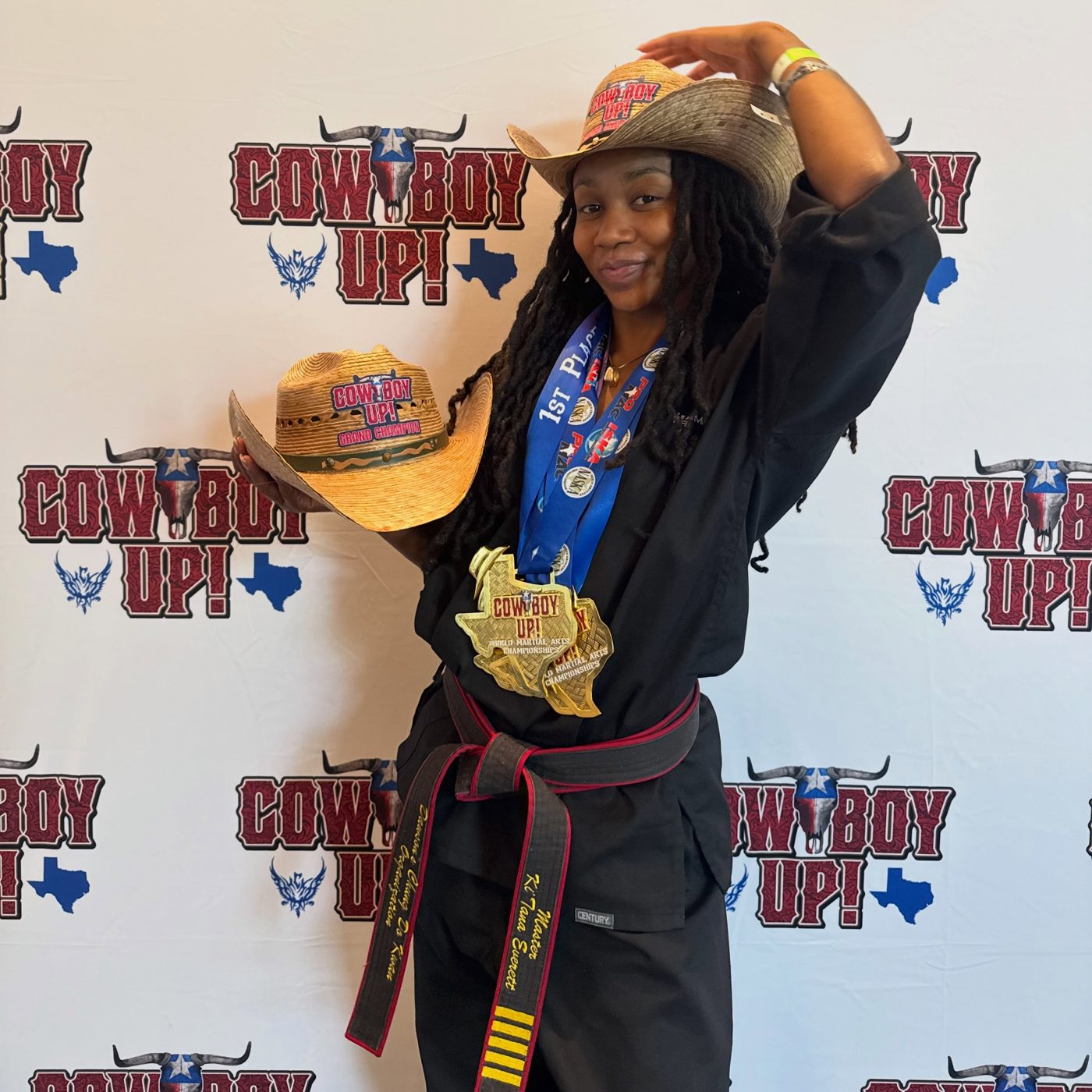 Ki'Tana Everett in a cowboy hat holding her medals at Cowboy Up 2026
